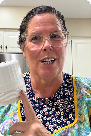 Home cook demonstrates a cordless mason jar sealer