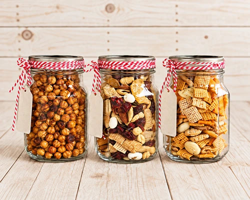 Mason jars filled with snacks and trail mix